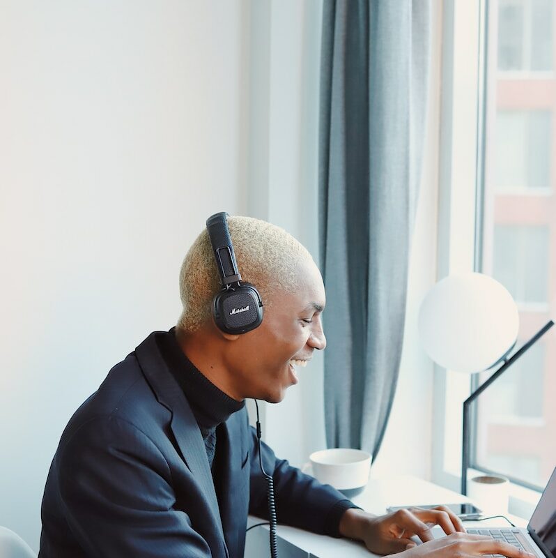 man in black jacket wearing headphones