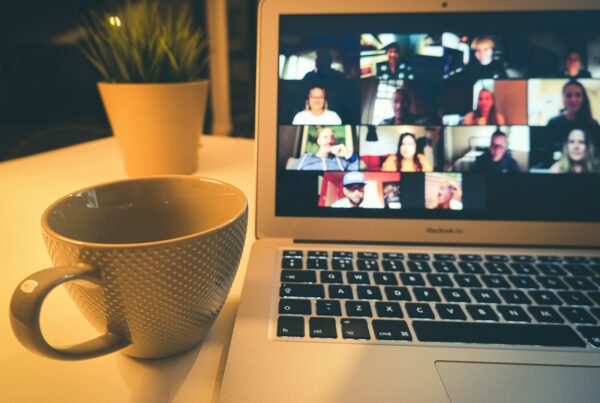 macbook air displaying woman in white shirt
